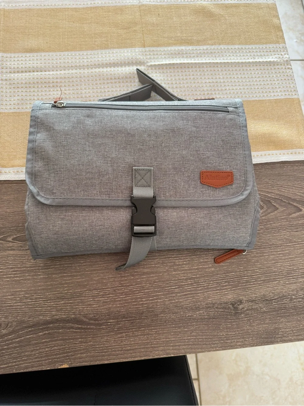 Travel diaper changing pad and storage